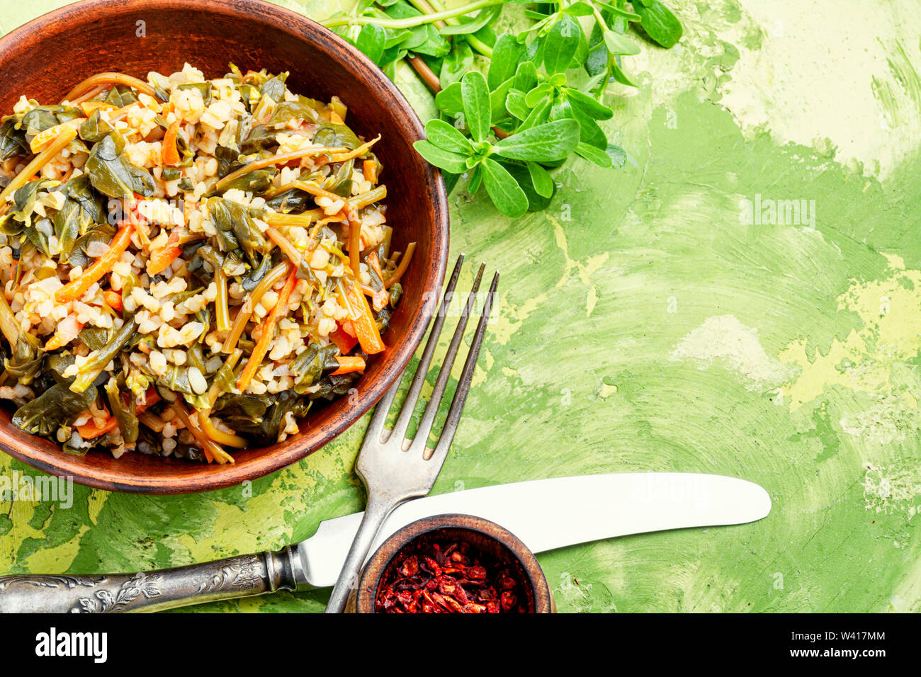 Popular food of the Middle East.Stew bulgur.Bulgur with portulak Stock ...