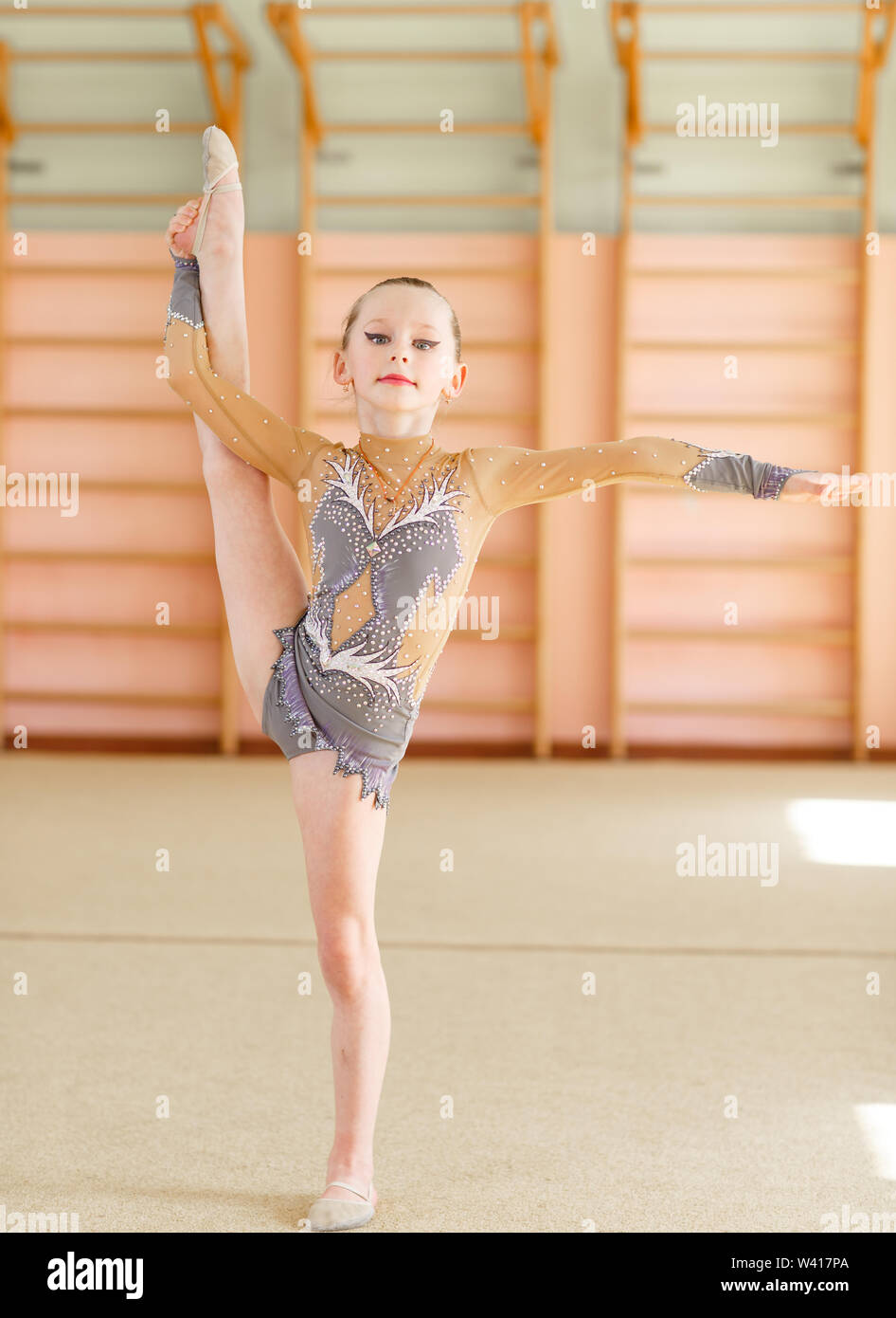 Young girl doing gymnastics in the gym Stock Photo Alamy