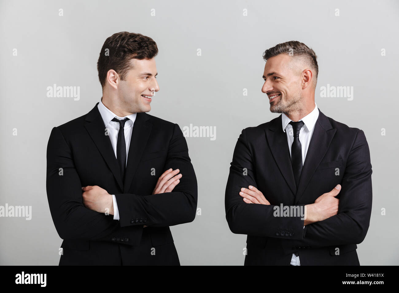 Black suits standing hi-res stock photography and images - Alamy