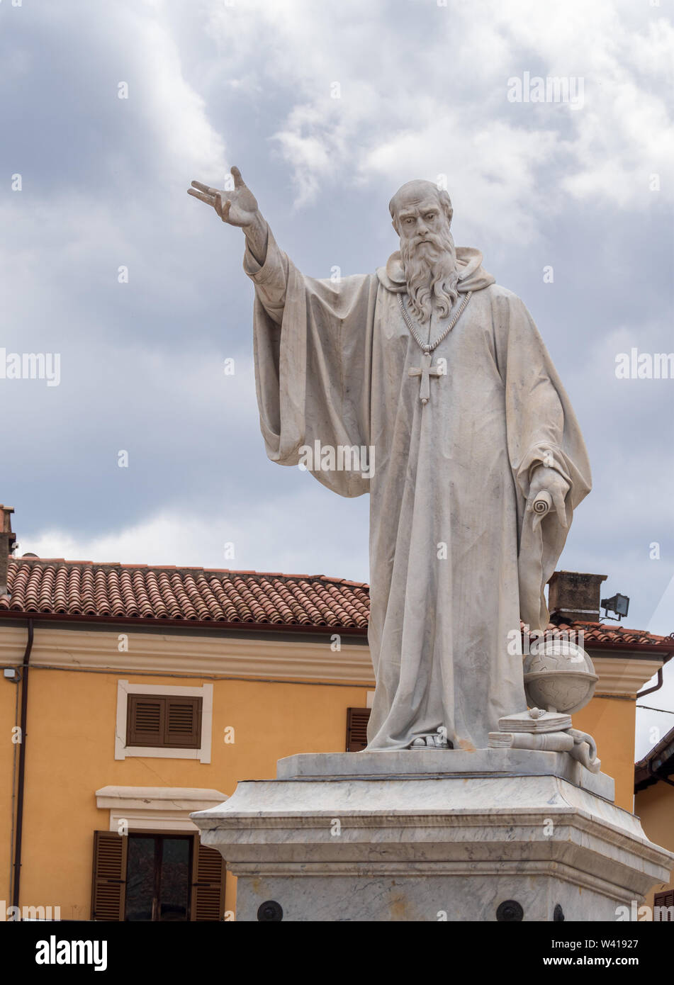 NORCIA, ITALY JULY 13, 2019: Three years after a devastating earthquake, much work still needs to be done. The statue of Saint Benedict in the square. Stock Photo
