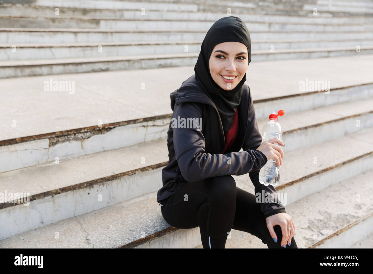Photo of a young smiling happy muslim 