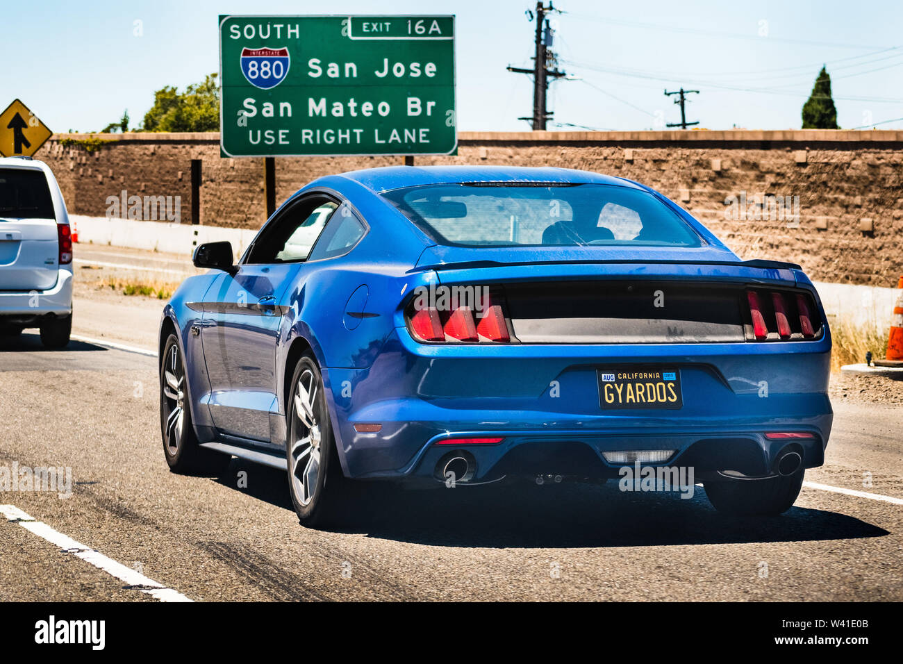 July 13, 2019 Berkeley / CA / USA - White Ford GT Mustang travelling on 880 Freeway in East San Francisco bay area; rear view Stock Photo