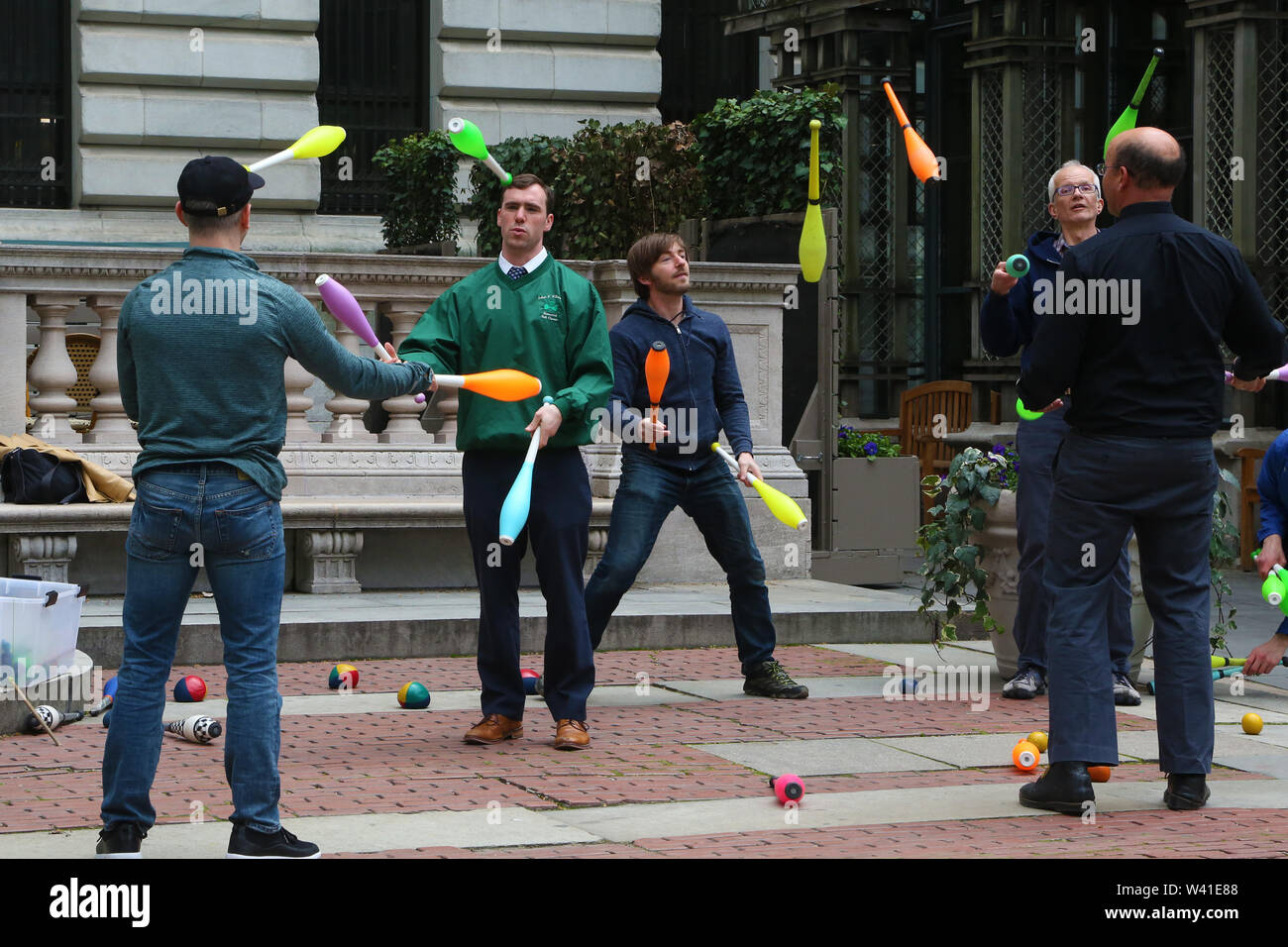 Amateur jugglers train in Bryant Park during lunch break Stock Photo