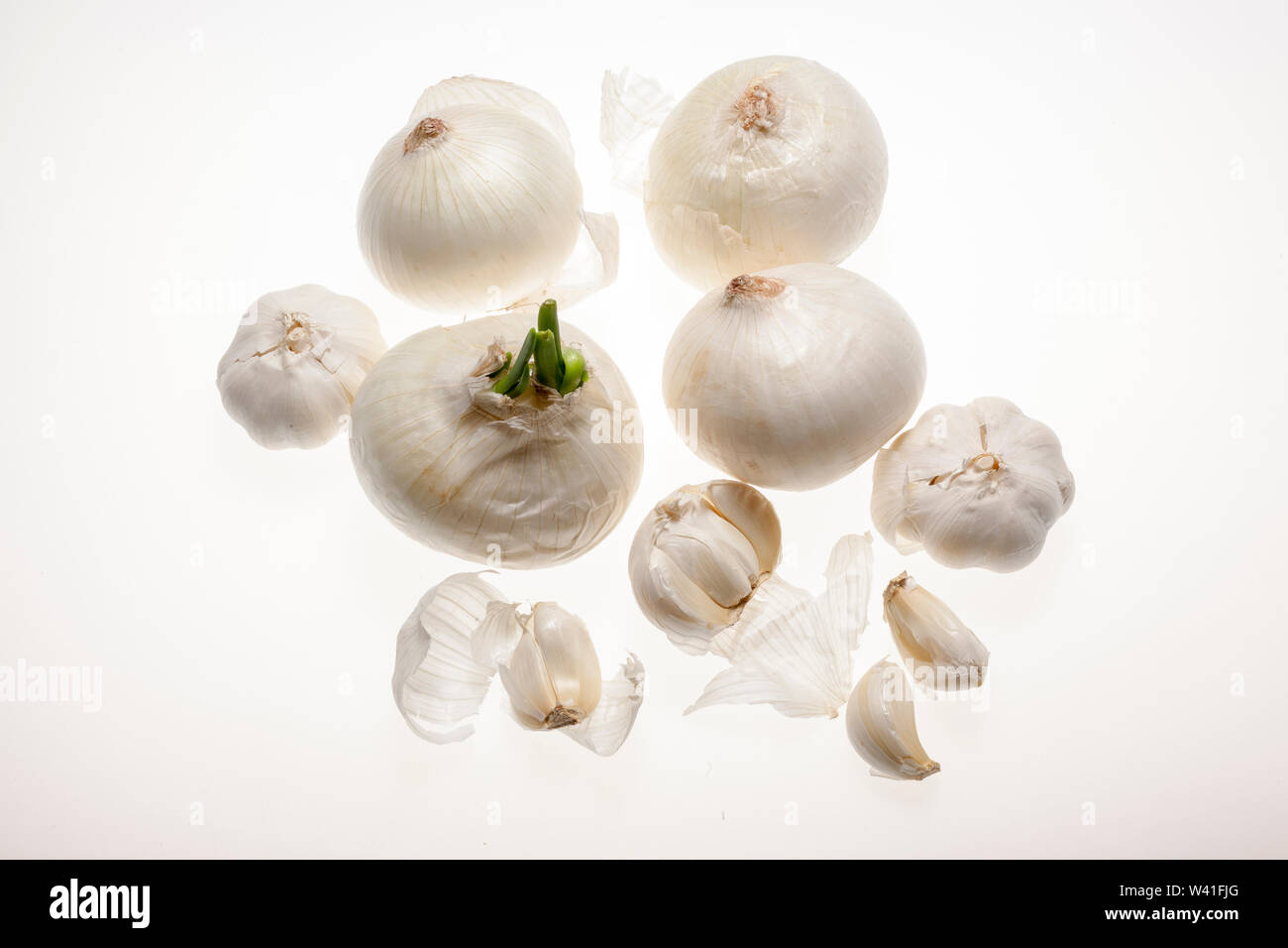fresh garlic and onion with flakes isolated on white Stock Photo - Alamy