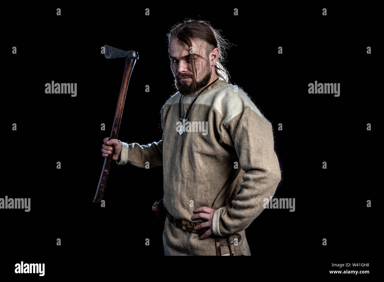 man in the clothes of the Viking Age with axe Stock Photo