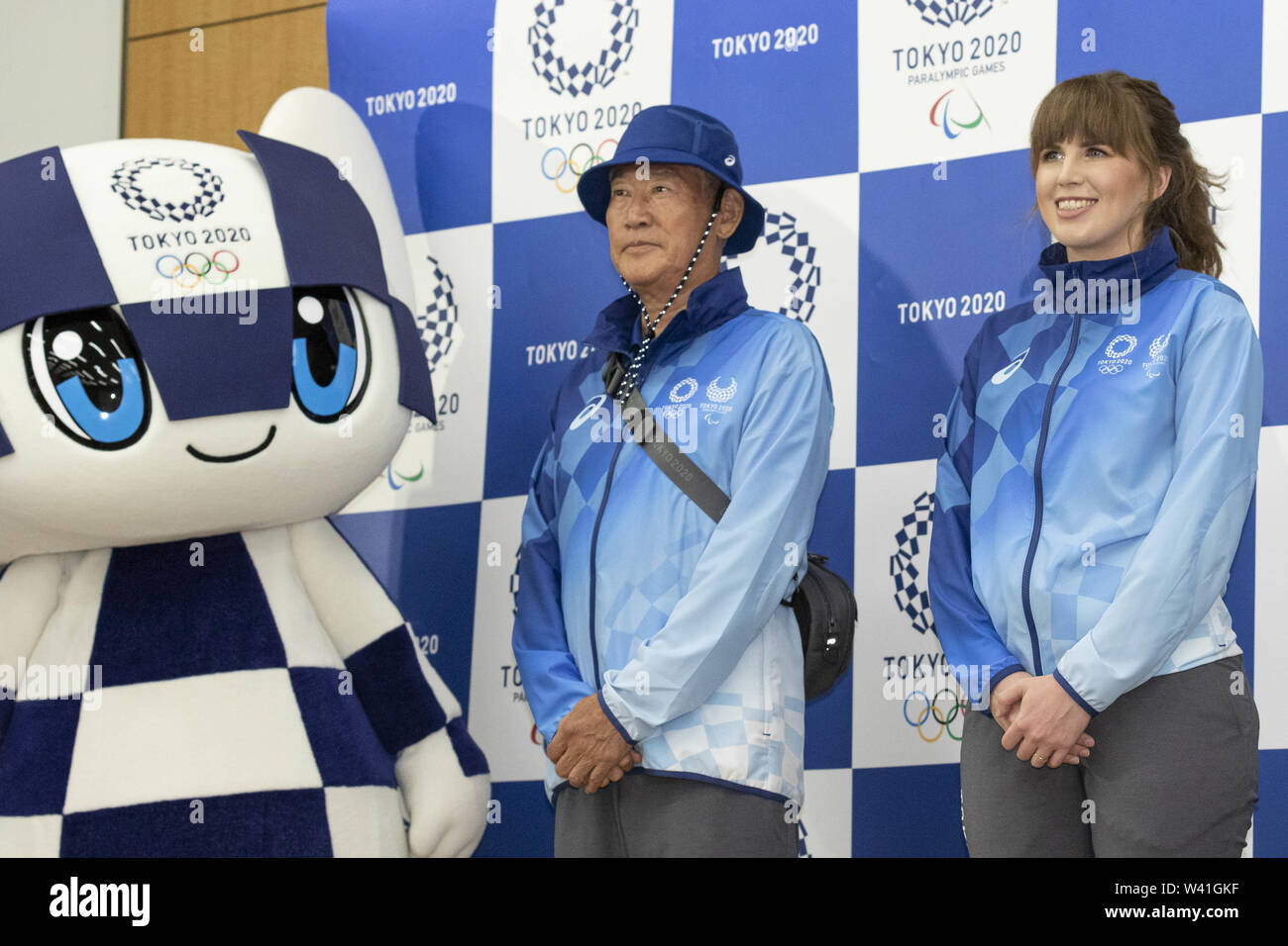 Tokyo, Japan. 19th July, 2019. Game Staff pose for the cameras during a news conference to unveil the Field Cast and City Cast Uniforms for the Tokyo 2020 Games. Organizers of the Tokyo 2020 Olympic and Paralympic Games (Tokyo 2020) unveiled the uniforms for Games Staff (the Field Staff) and City Volunteers (the City Cast) during the 2020 Games. Credit: Rodrigo Reyes Marin/ZUMA Wire/Alamy Live News Stock Photo
