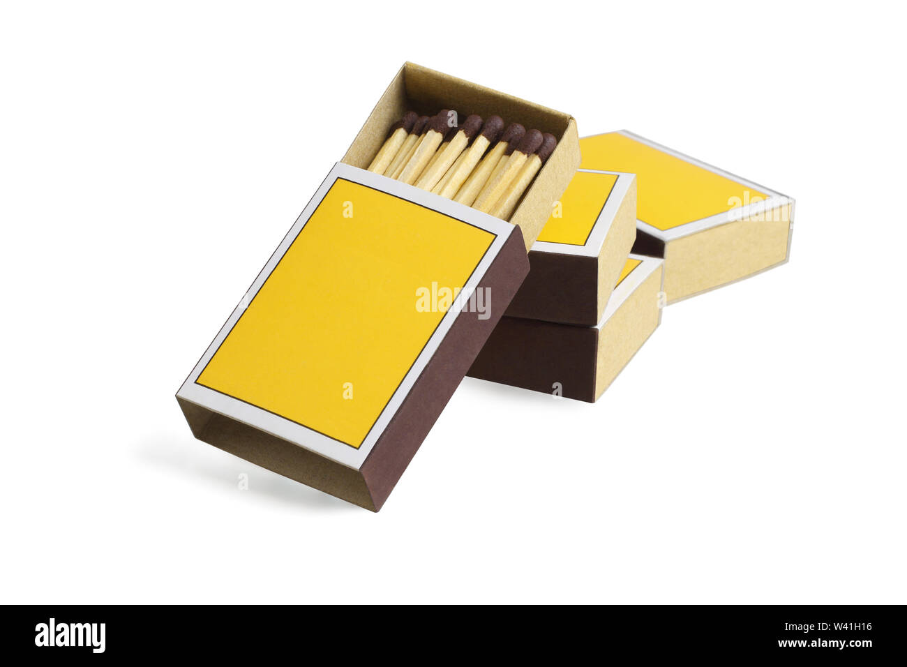 Four Yellow Match Boxes on White Background Stock Photo