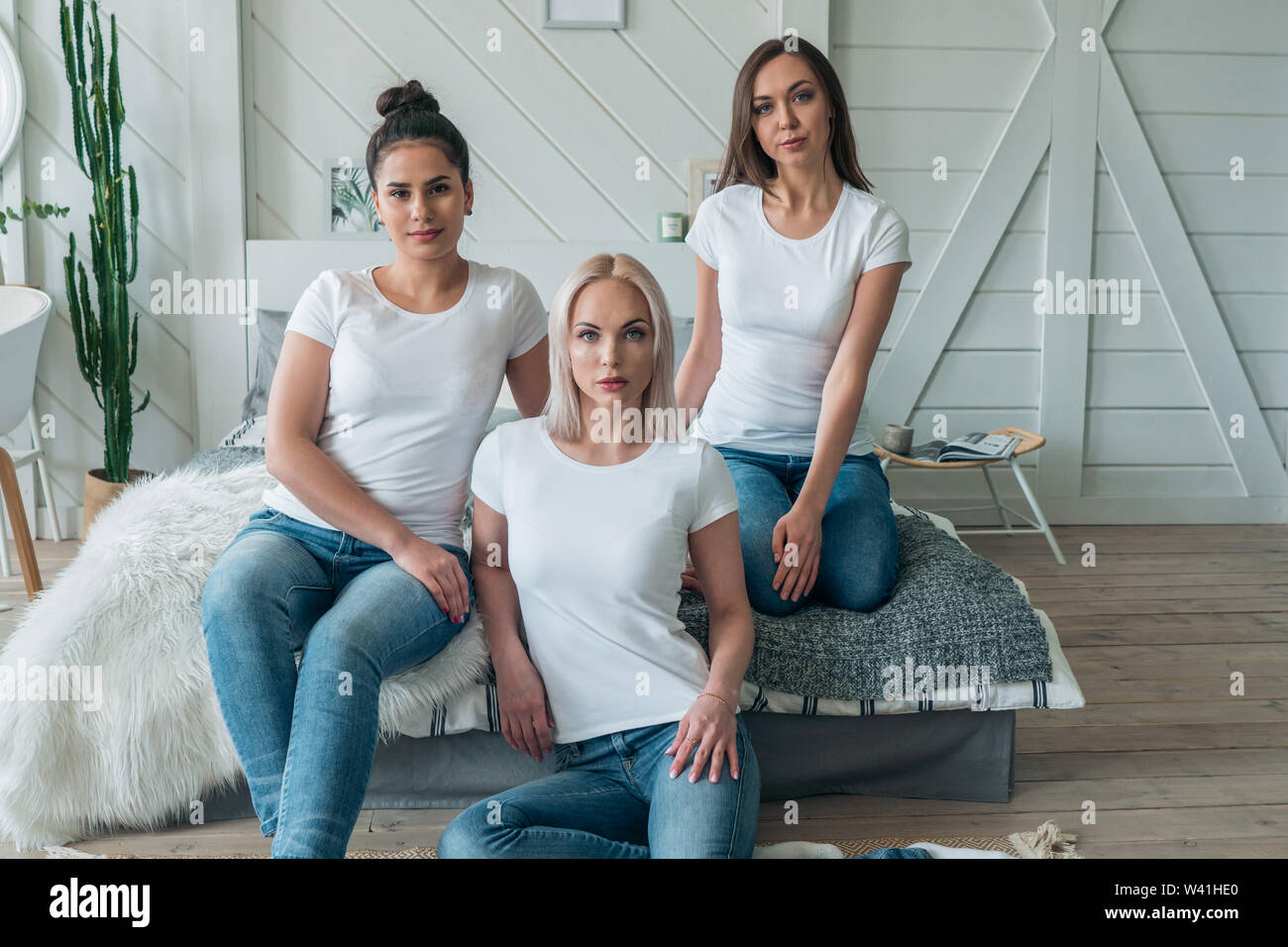 Beautiful girls model of Caucasian appearance. Layout for design on white t-shirts. Stock Photo