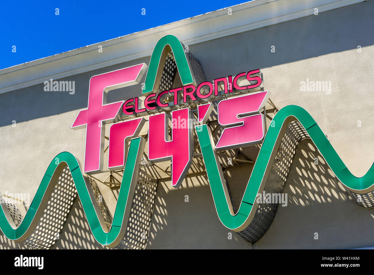 July 12, 2019 Sunnyvale / CA / USA - Fry's Electronics sign on a store front; Fry's Electronics is an American retailer of software, consumer electron Stock Photo
