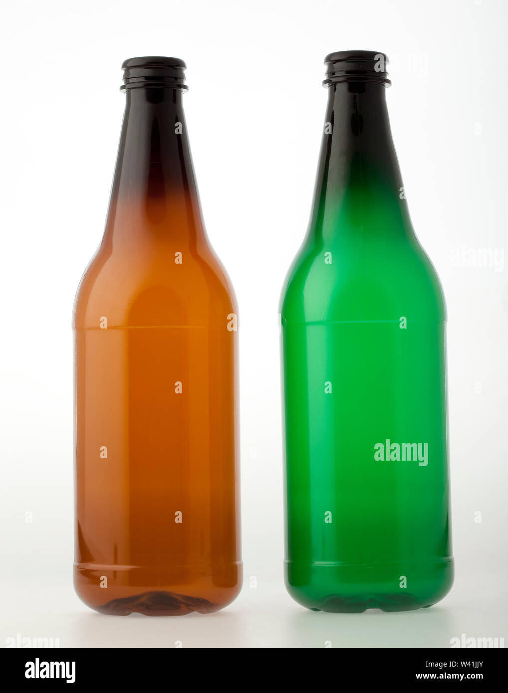 Empty brown and green plastic bottles for beer or other beverages Stock Photo