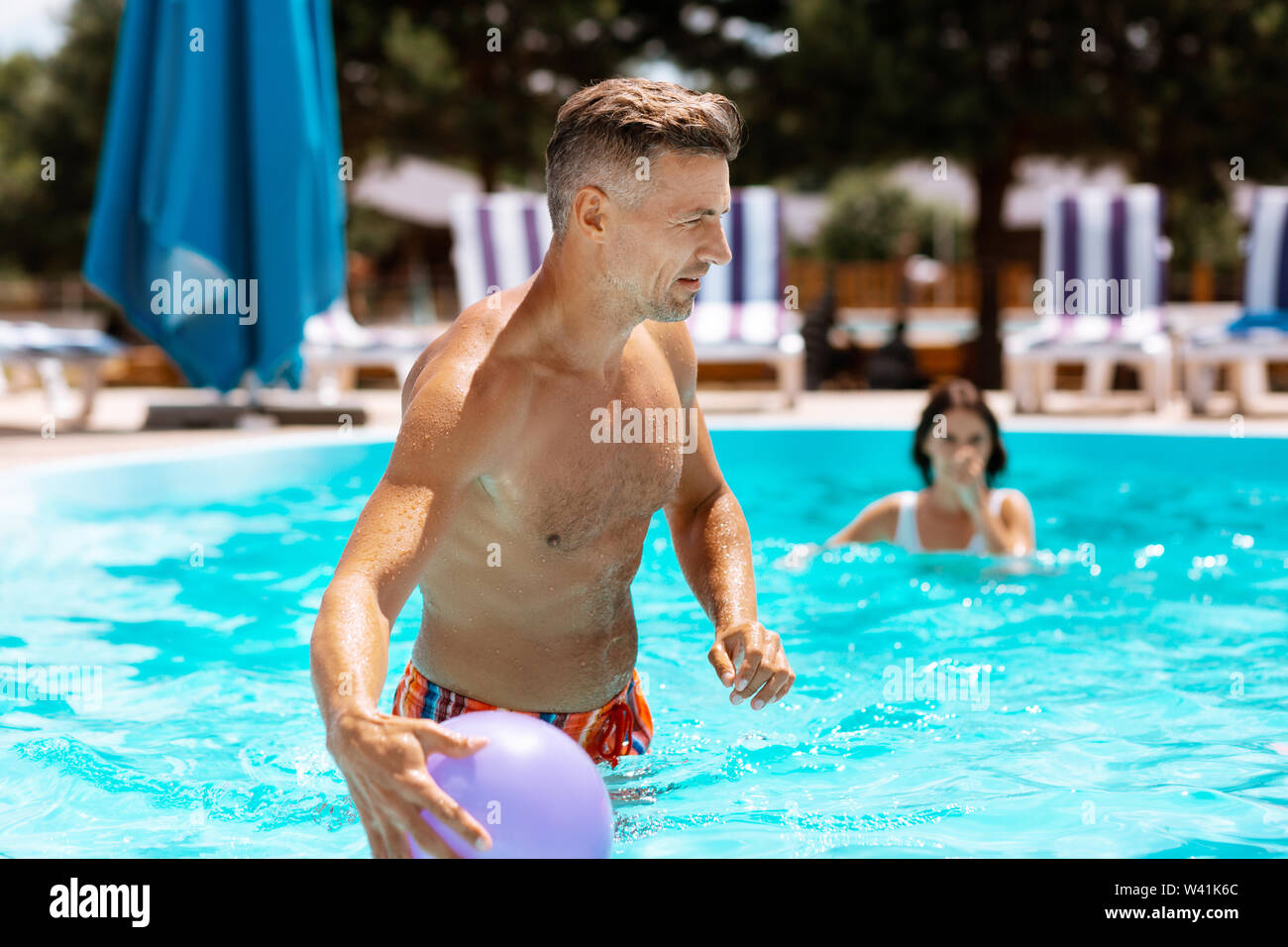 Male female holiday athletic pool hi-res stock photography and images ...