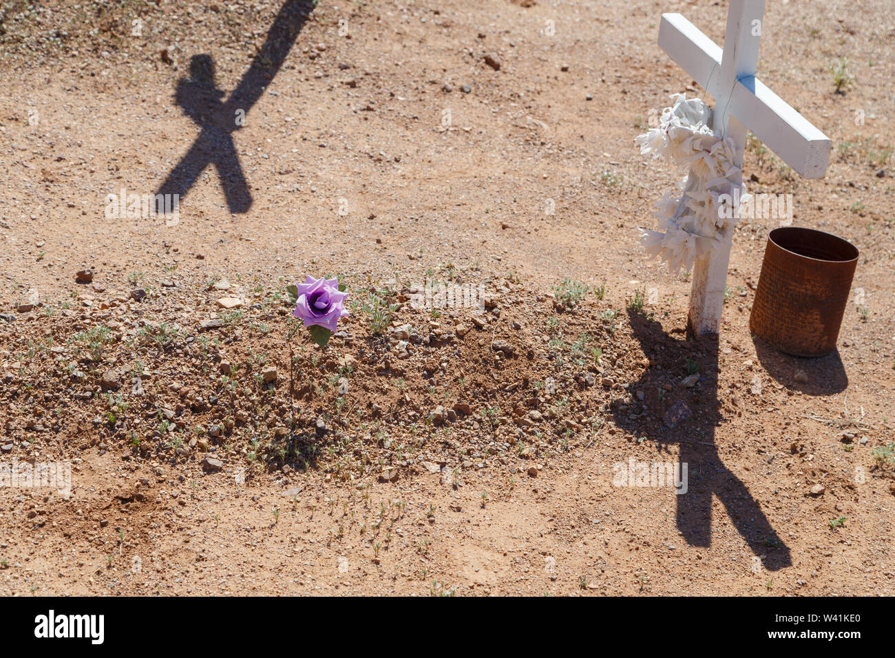 Artificial flowers and crosses are placed on unmarked graves of migrants died while trying to cross Sonoran desert in Southern Arizona, USA. Stock Photo