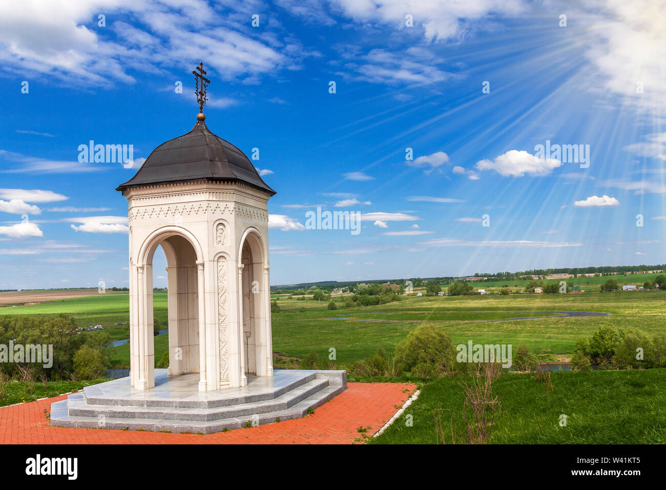 Rotunda chapel on the high bank of the river against the blue sky Stock ...