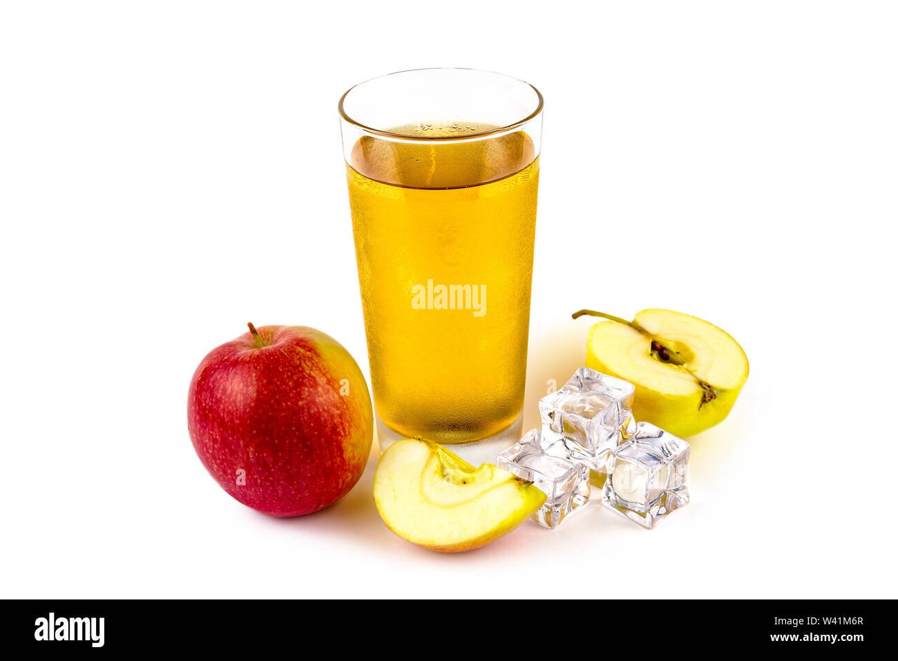 Apples apple juice and ice cubes on a white background Stock Photo