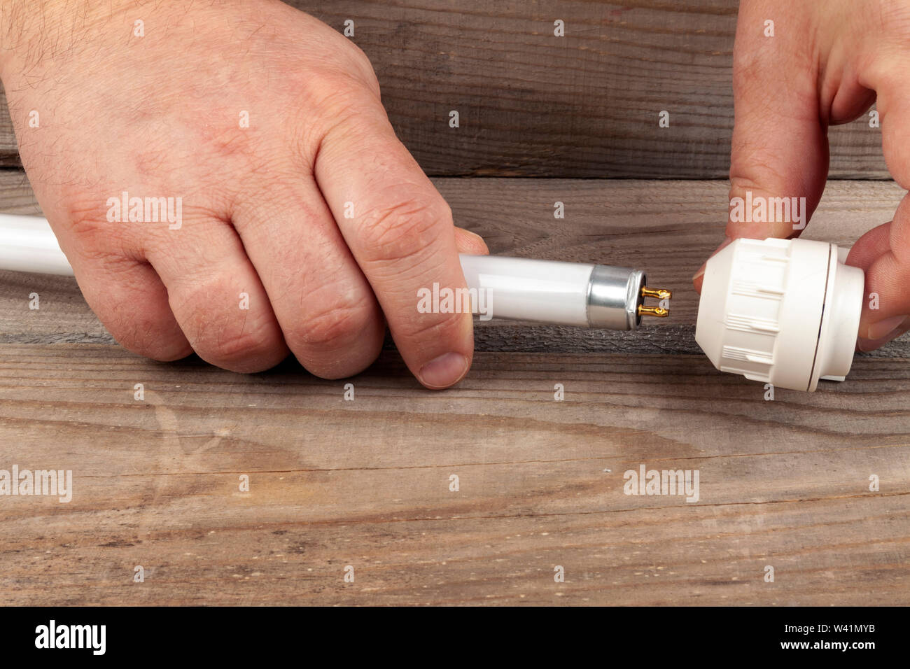 Assembly lamp lamp everything lies on a wooden background Stock Photo