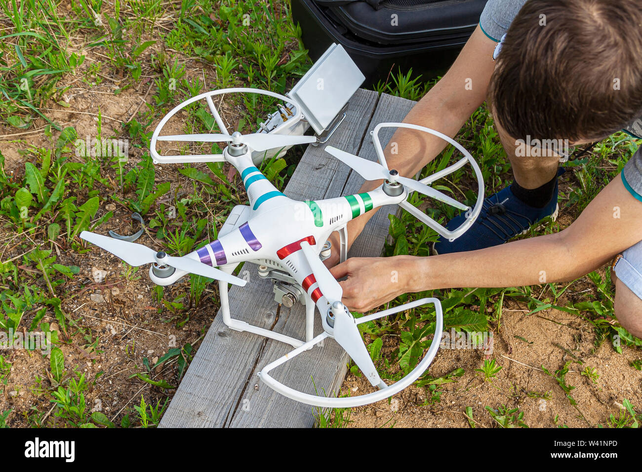 Kaluga, Russia 06/02/2019 A man prepares for flight a quadrocopter checks its serviceability. Stock Photo