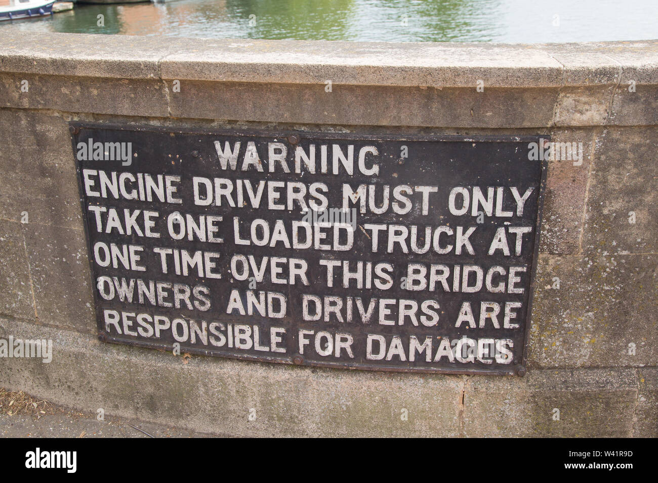 Historic warning sign on the bridge over the Thames at Henley-on-Thames.'Warning. Engine Drivers must only take one loaded truck at one time over this Stock Photo