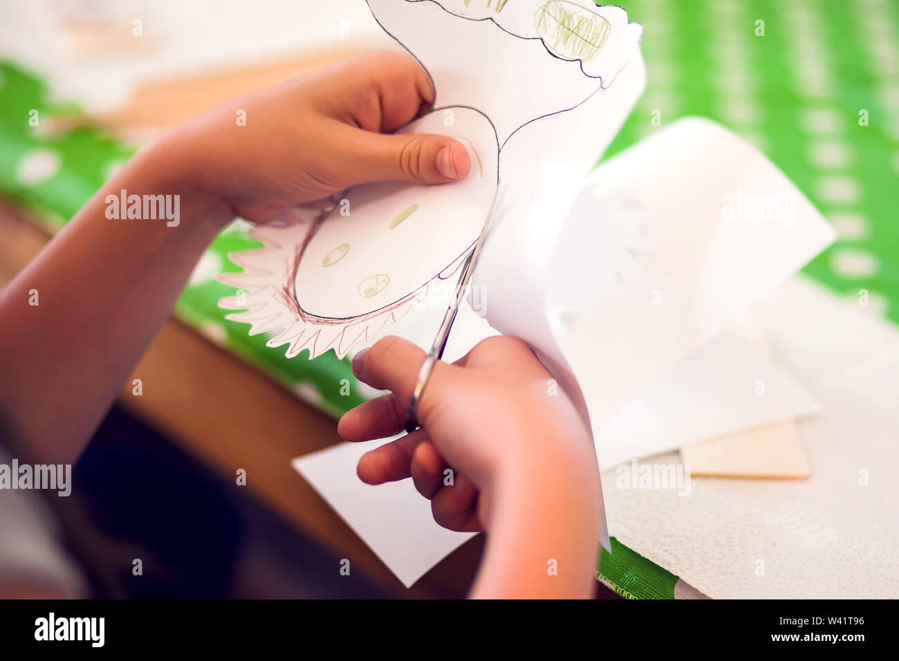 Children hands making artworks with wood and paint crafts. workplace