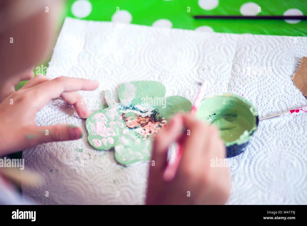 Children hands making artworks with wood and paint crafts. workplace
