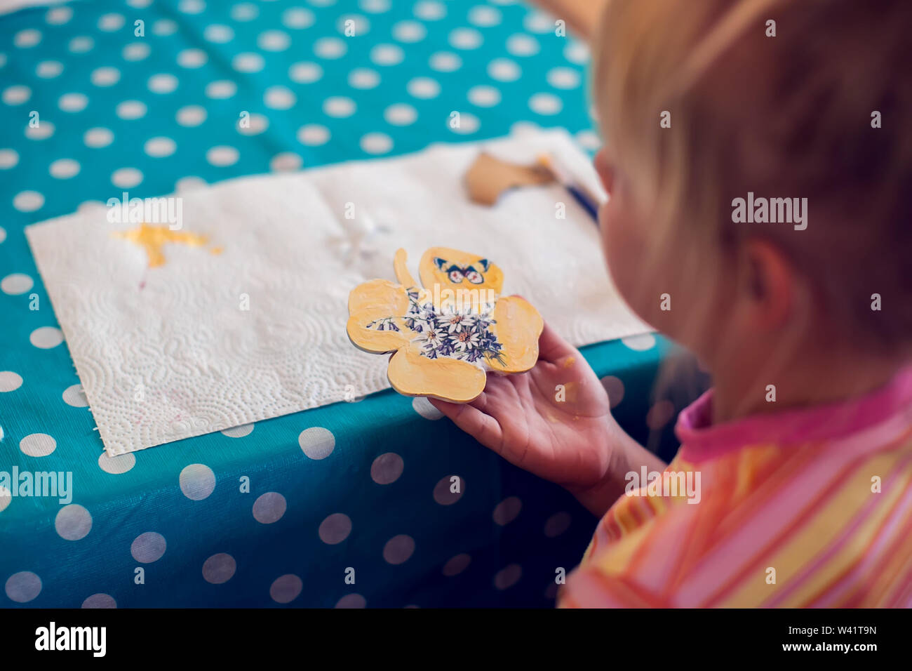 Children hands making artworks with wood and paint crafts. workplace
