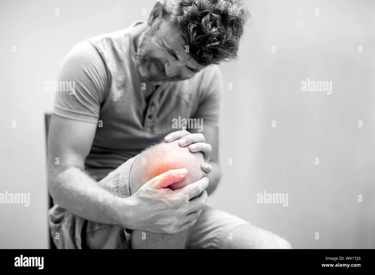 Man with knee pain close up. Pain relief concept Stock Photo
