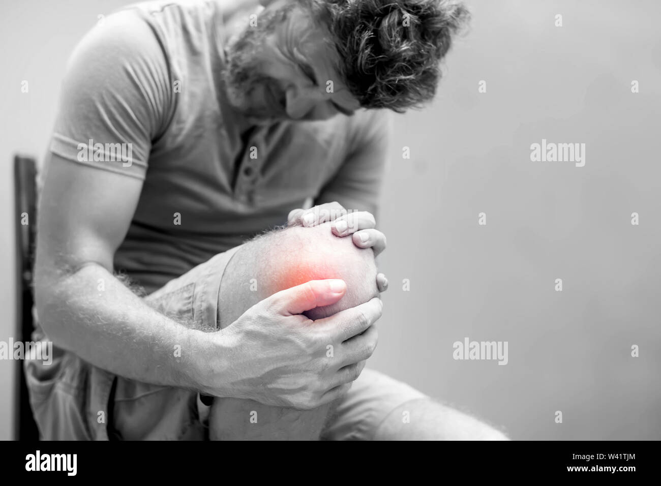 Man with knee pain close up. Pain relief concept Stock Photo