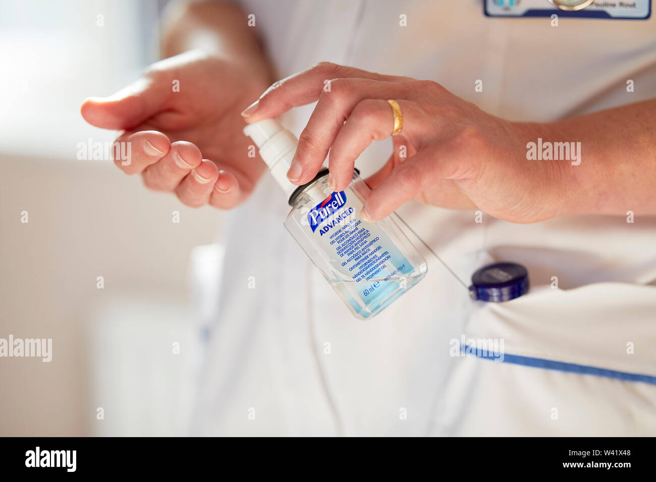 Nurse cleansing hands Stock Photo