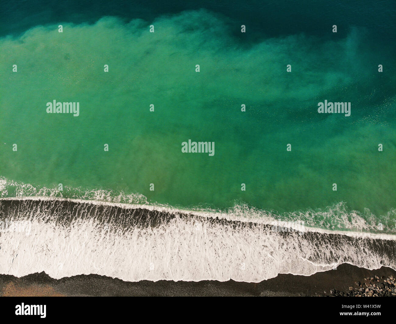 aerial view of gradient turquoise colour sea waves motion splashing Stock Photo
