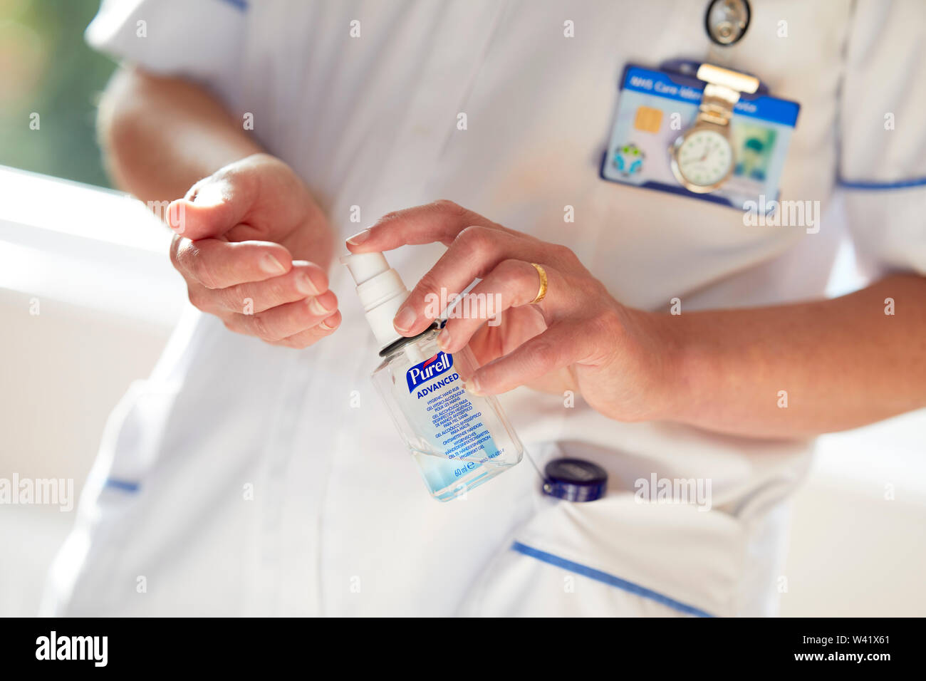 Nurse cleansing hands Stock Photo