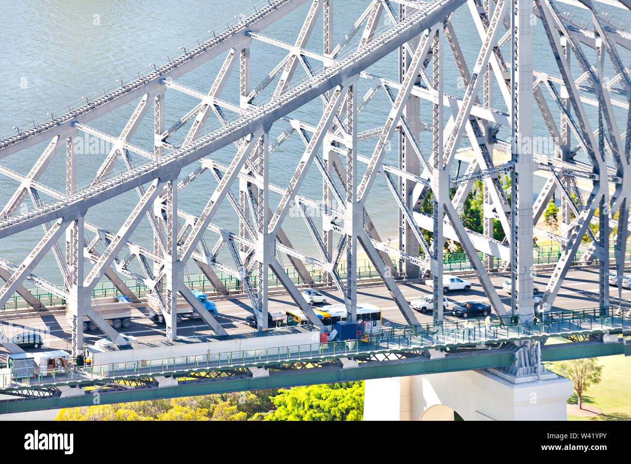 Closeup of a modern metal bridge over the river that showing steel