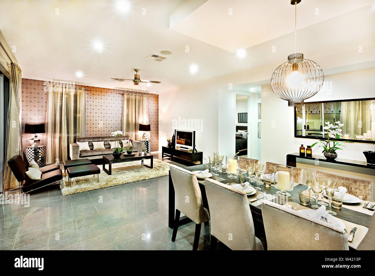 Luxury Living Room And Dining Area With Hanging Lights