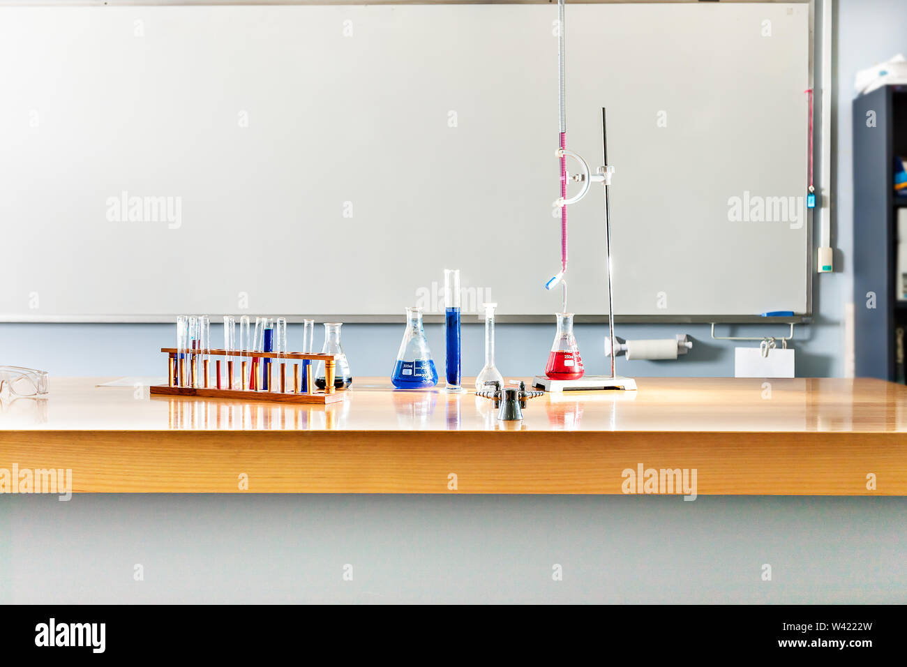 Laboratory items on the table, including sample test tubes and beakers ...