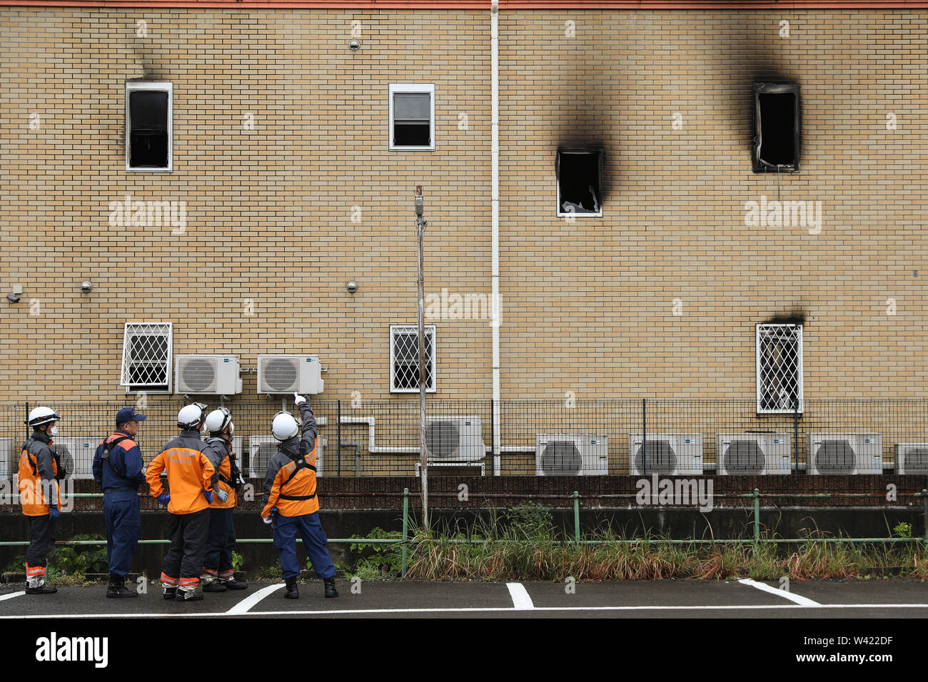 Kyoto, Japan. 19th July, 2019. Firemen work at a Kyoto Animation studio  building after an arson attack in Kyoto, Japan, July 19, 2019. The motive  behind an alleged arson attack on a