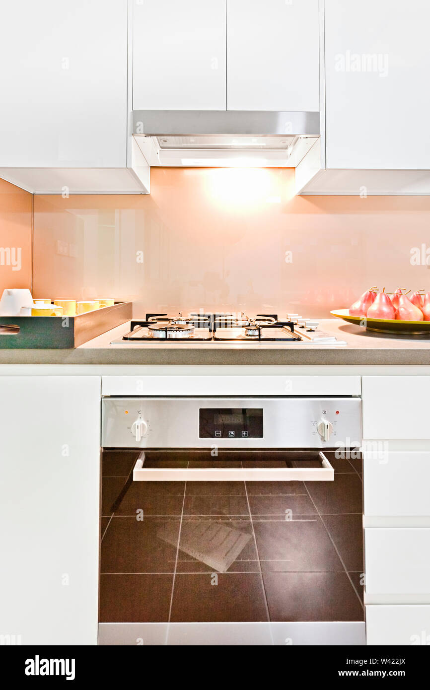 Kitchen tools with oven and cooker near walls, pantry and gas cookers