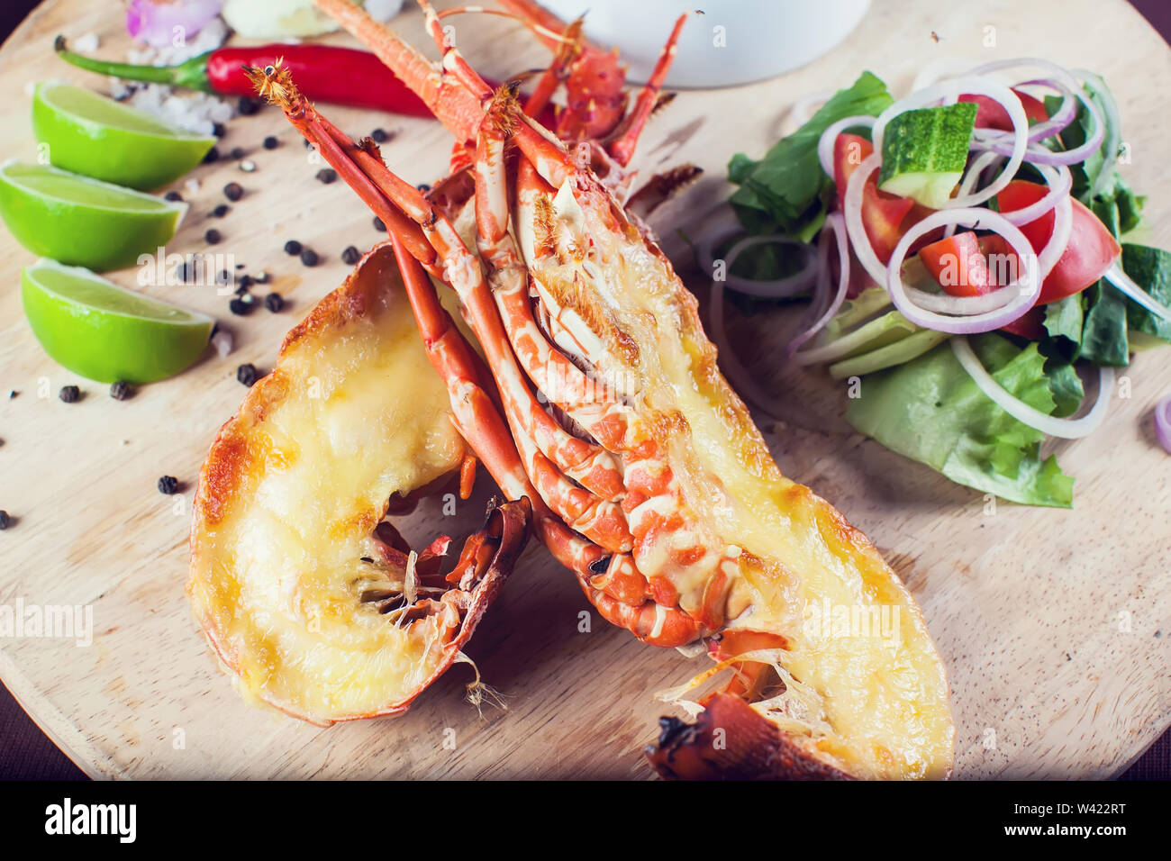 A luxury dish of lobster roasted and decorated with many items of