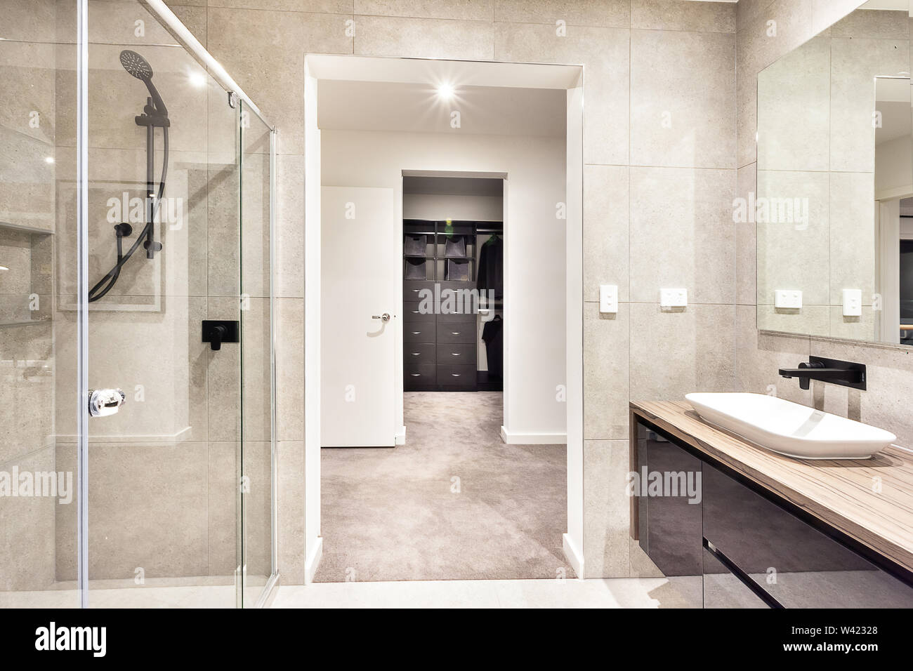 Entrance To A Laundry Room Through The Modern Washroom With A