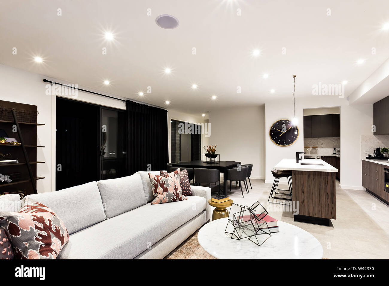 Luxury Living Room With Sofas And Pillows Beside Kitchen