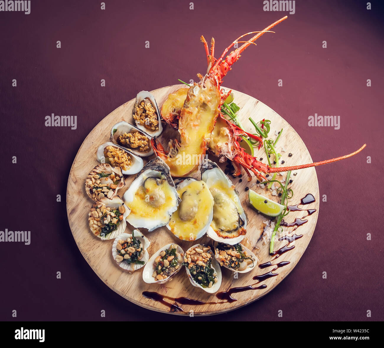 A luxury dish of lobster roasted and decorated with many items of