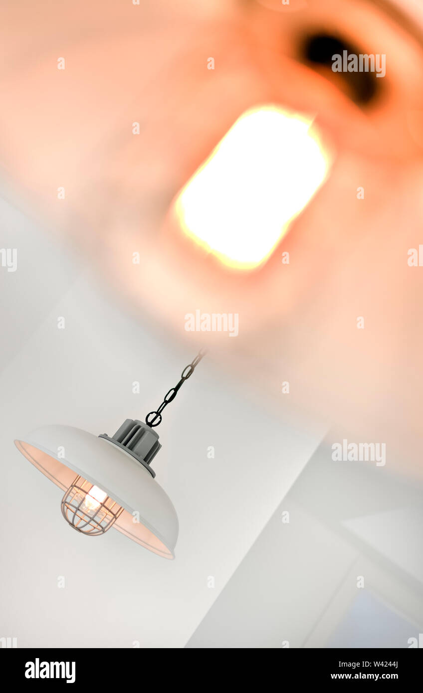 Angled View Of A Hanging Light Flashing With A Blurry Light