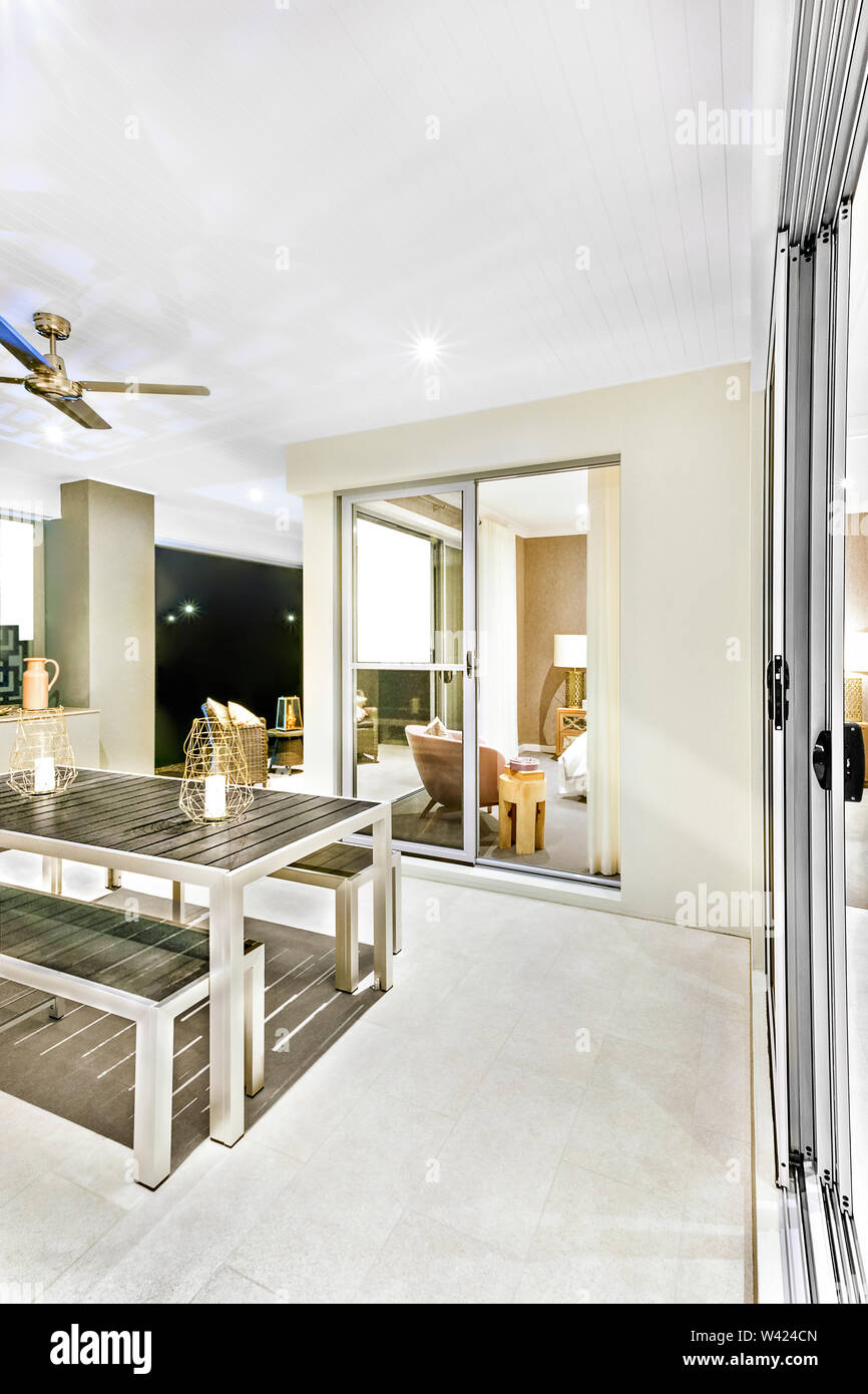 Dining Table With A Glass Door Opened At Night With Flashing