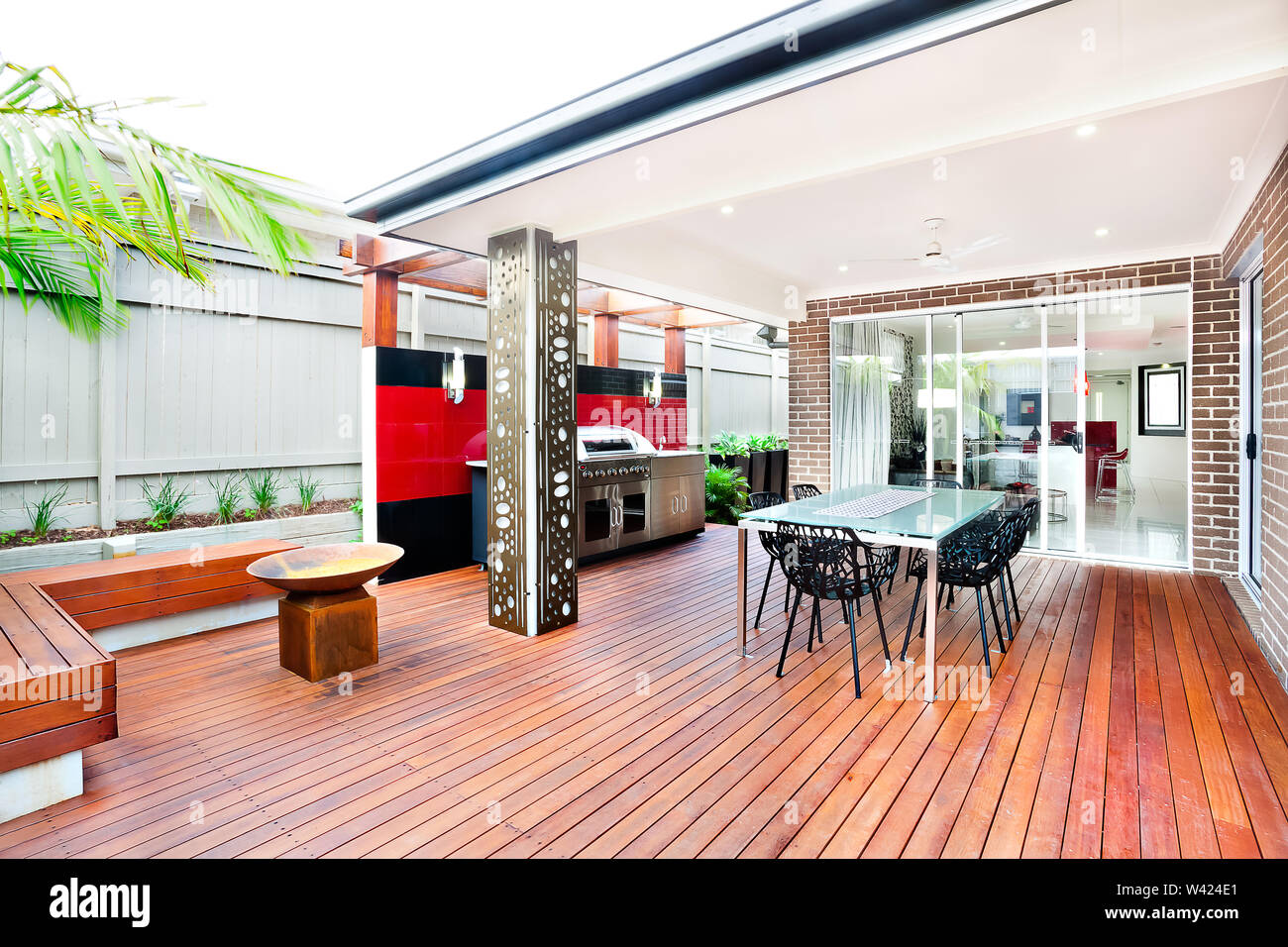 This luxury house has brick walls and a glass door from the patio side ...