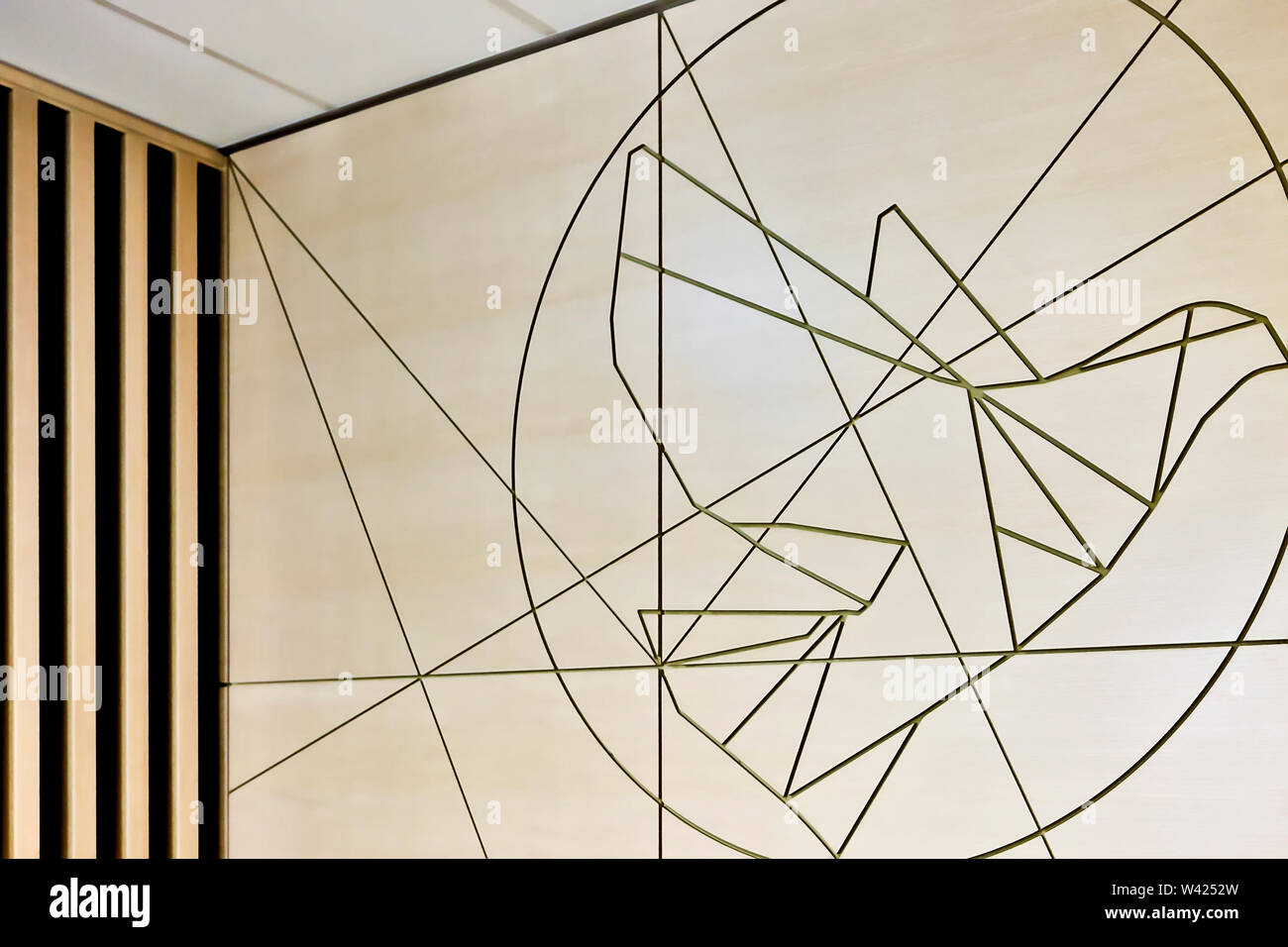 Creative wall art design using embossed lines on a thin wall Stock