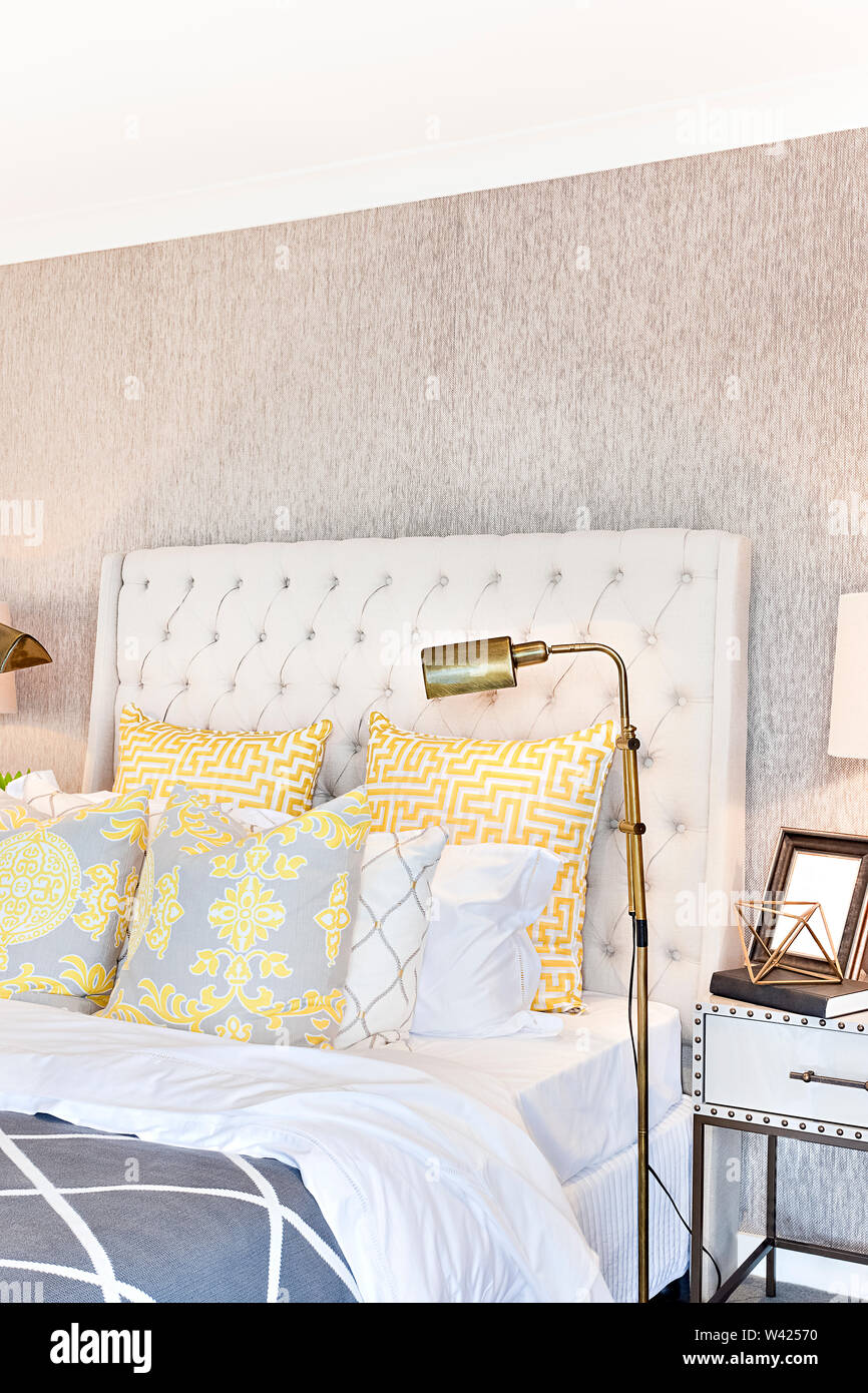 Bedside Pillows Close Up With Yellow Color Beside Lamps