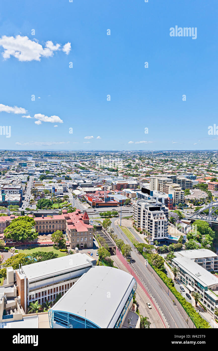 City view with natural trees and buildings, green plants near roads ...