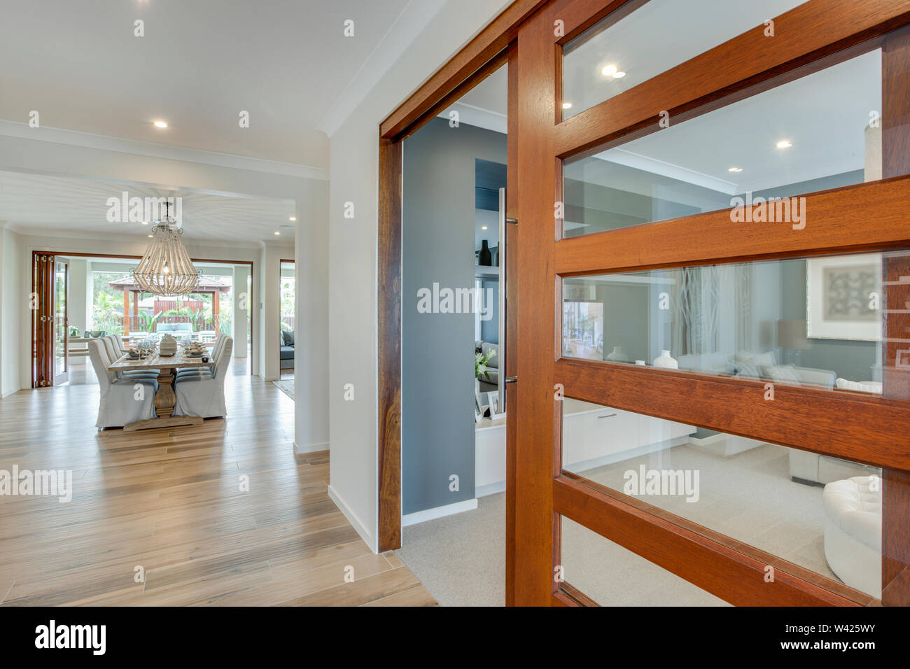A Stylish Glass Door With Wooden Frame Giving Entrance To A