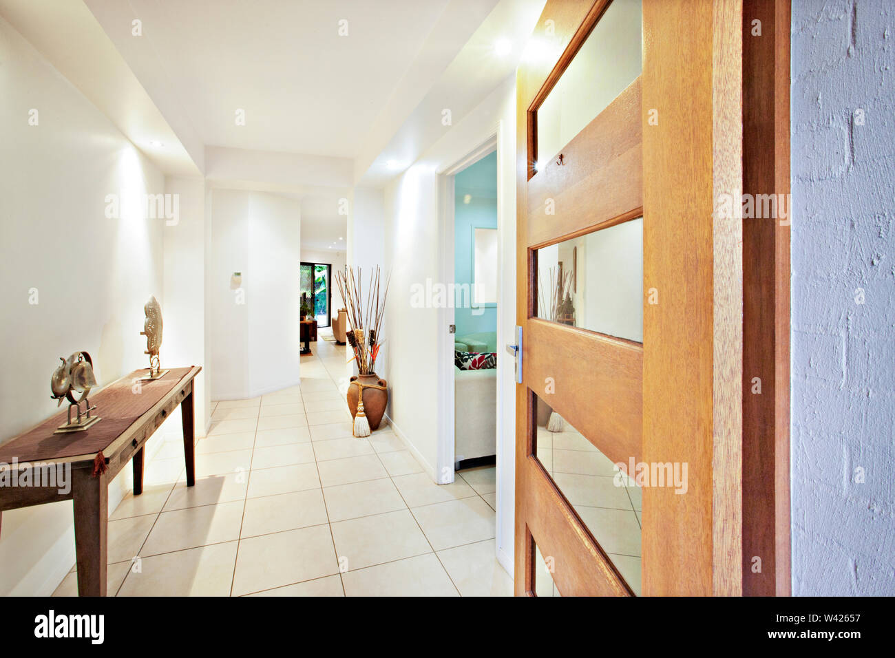 Wooden Table And Door Near Home Entrance Comfortable