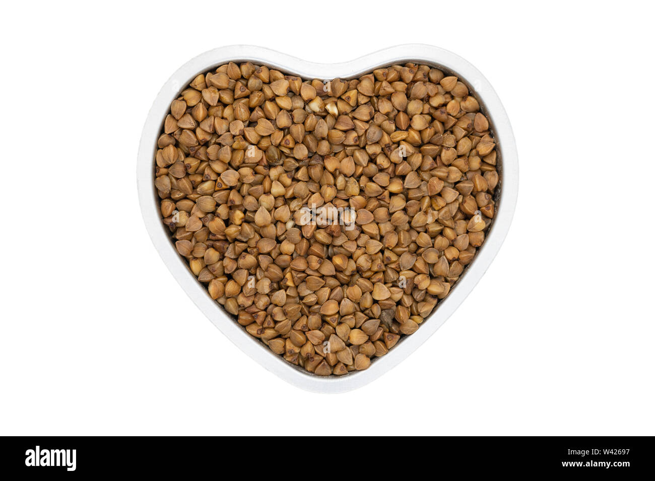 Buckwheat groats, heartshaped, close up. Gluten free and non