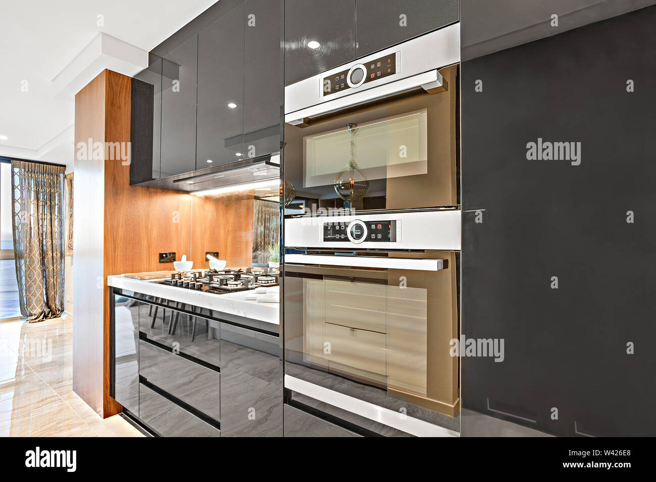 A modular kitchen featuring designer cabinets gas hob and