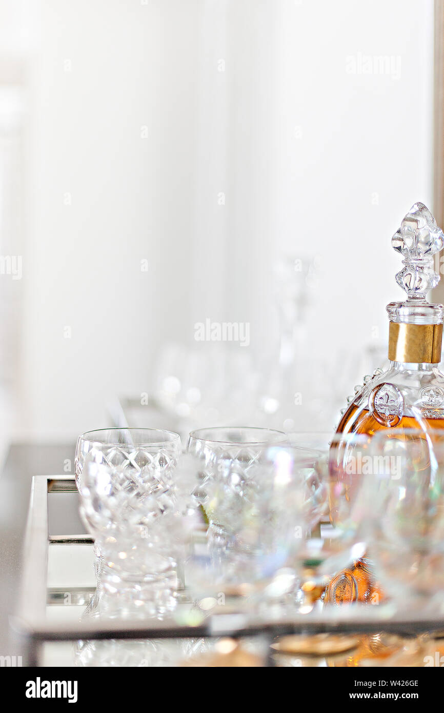 Classic glass barware placed with a liquor bottle Stock Photo