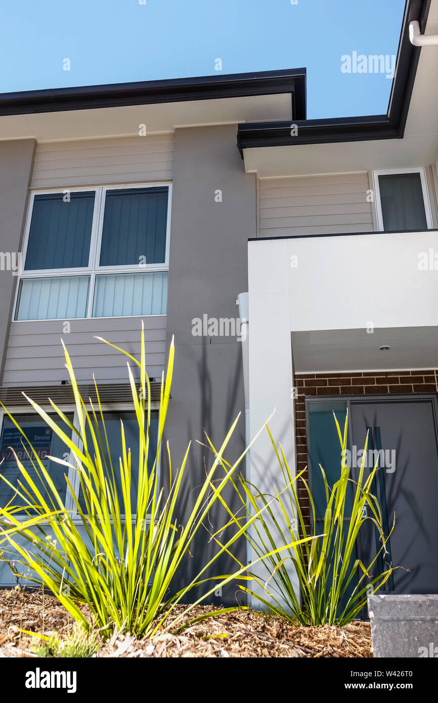 Front view of a modern two storey house Stock Photo - Alamy